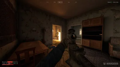 WARDOGS first-person view inside a house, aiming a scoped rifle toward a doorway